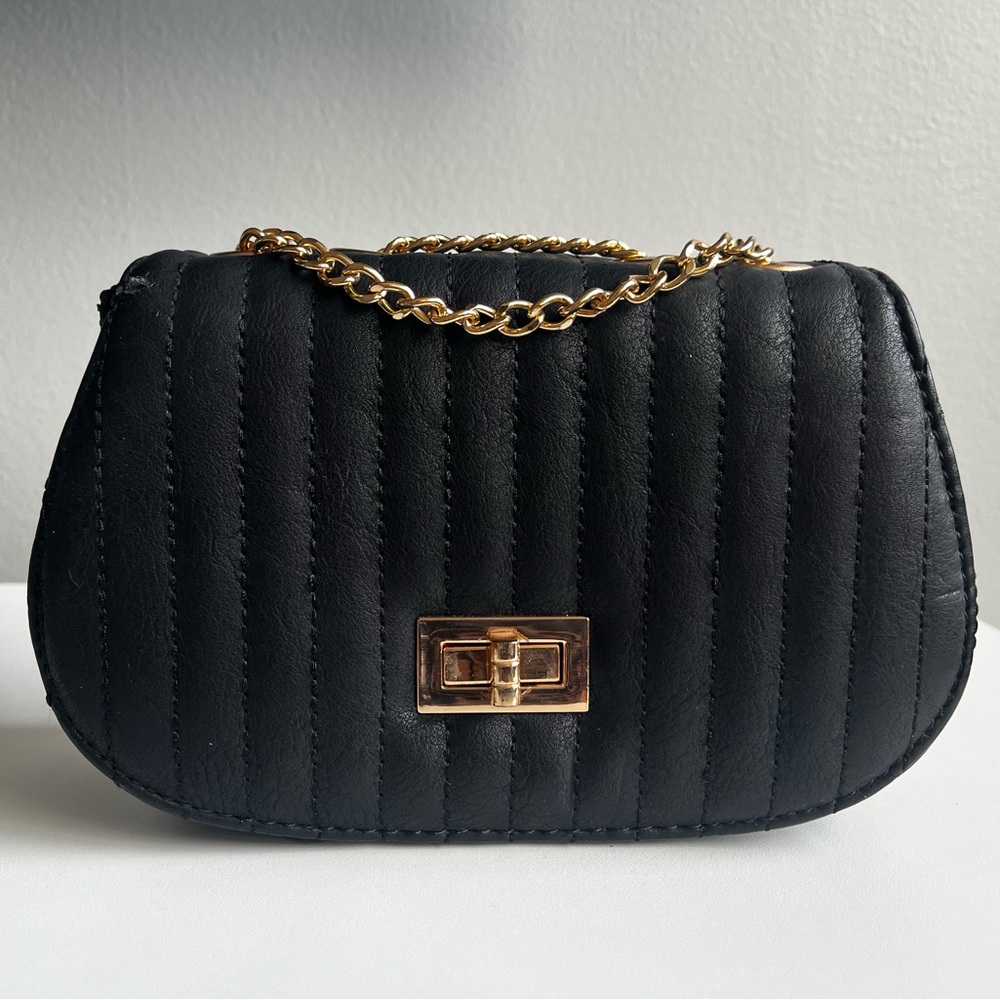 Small black cross body bag with gold long chain